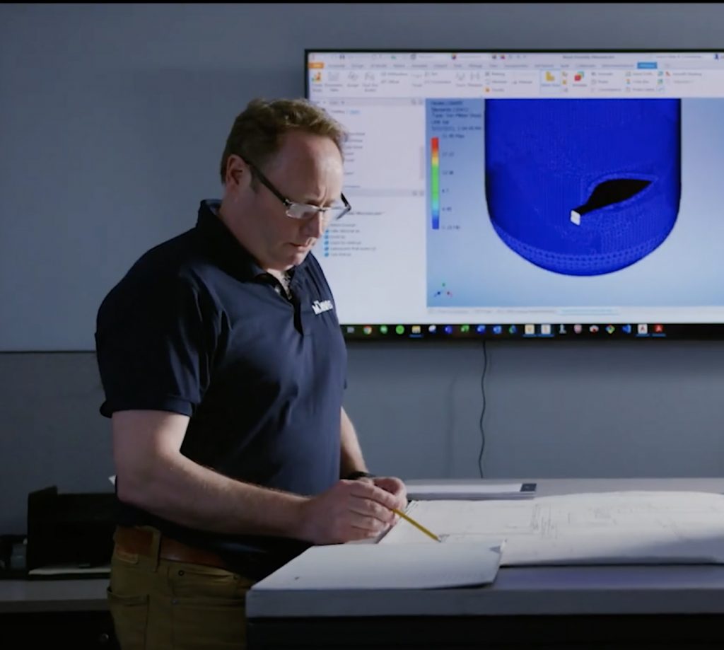 An M. Davis & Sons employee working on engineering designs