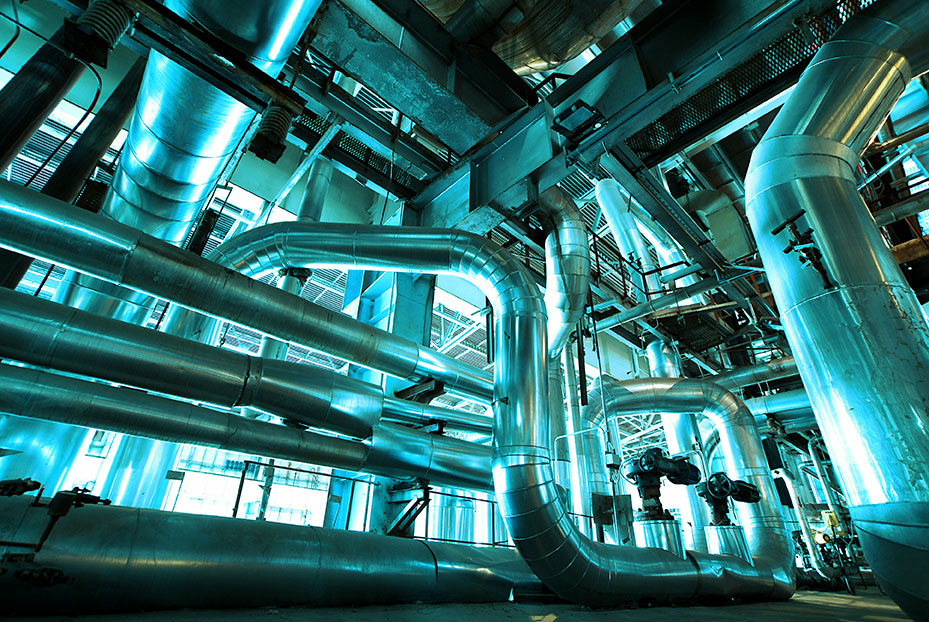 Different size and shaped pipes and valves at a power plant